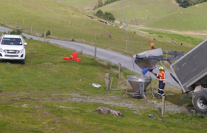 Hard-hat worker preparing aerial equipment